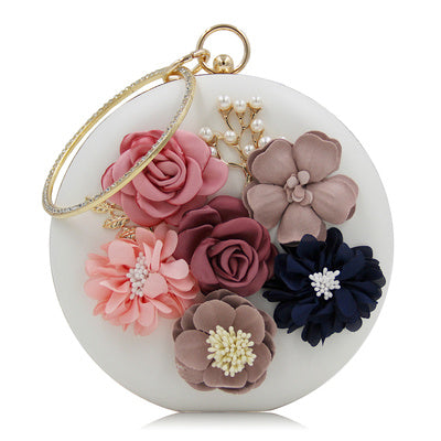 Pochette ronde élégante en cuir rouge avec motif floral