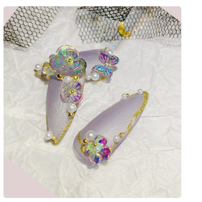 Ongles en forme de papillon et de fleur congelés
