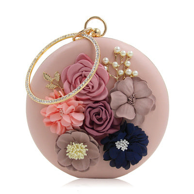 Pochette ronde élégante en cuir rouge avec motif floral