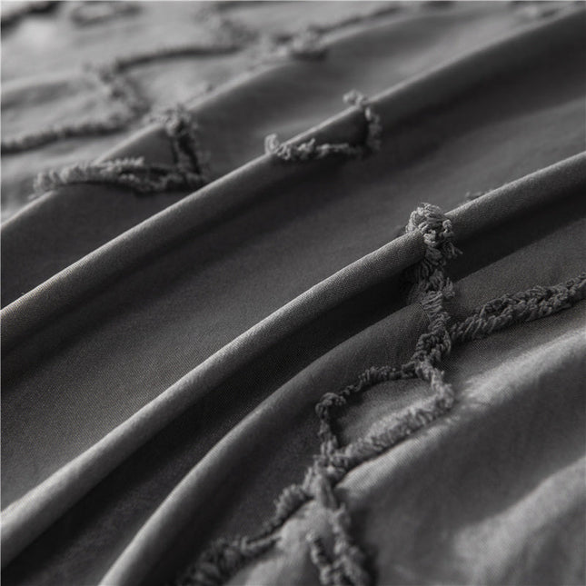 Close-up of intricate patterns on the Artistic Bohemian Quilt Cover Set in earthy tones.